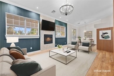 Living room featuring a chandelier, wood finished
