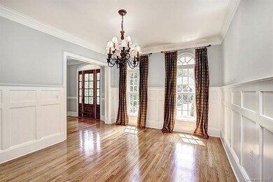 Dining Room with Heavy Moldings and Trim, Arched W