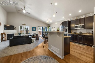 Kitchen with light wood-type flooring, appliances 
