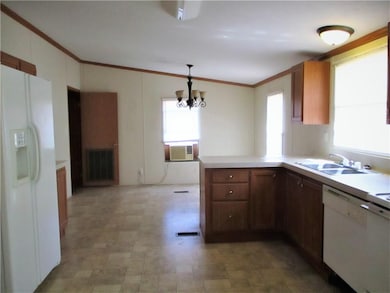 Spacious kitchen with plenty of cabinets, pantry (