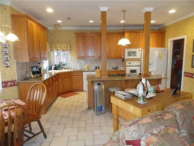 Kitchen. Large kitchen open to eating area and fam