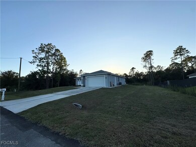 View of home's exterior featuring a garage, concrete driveway, and a​​‌​​​​‌​​‌‌​​​‌​​‌‌​‌‌​​​‌‌‌​​​​‌​​​​​‌ lawn