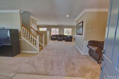 Entry, Open floor plan, crown molding.
