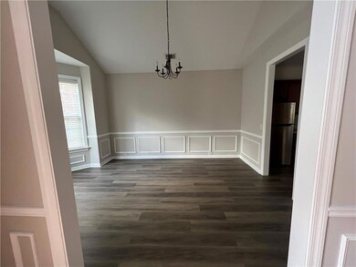 Unfurnished dining area with dark hardwood / wood-