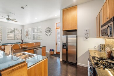 Kitchen with stainless steel appliances, a ceilin