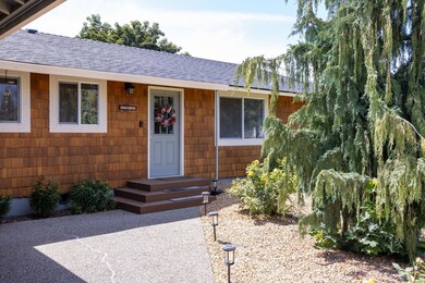 Front entrance with smooth pebbles