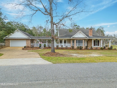 Side of House & Garage/Driveway