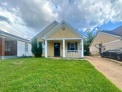 View of front of house featuring covered porch and concrete driveway
