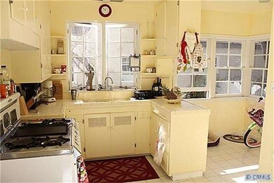 Bright kitchen with bay window and breakfast nook.