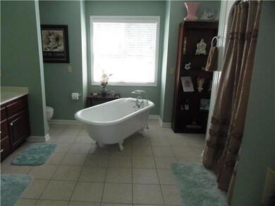 Spacious master suite with soaking tub and his /hers closets