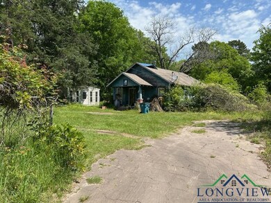 View of front of property with a front yard