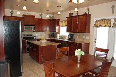 Kitchen features 6 Pendant lights as well as a cei