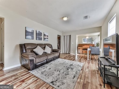 Living room with light wood-type flooring