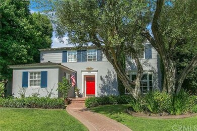 A Charming Brick Walkway & Mature Trees Lead to Yo