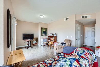 Tiled bedroom featuring baseboards and visible ven