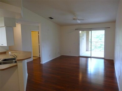 Great room featuring laminate flooring & high ceilings