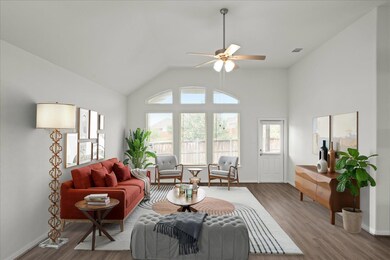 Living room with ceiling fan, wood finished floor