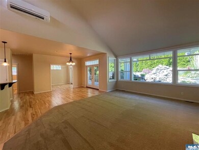Dining area with French door exit to aggregate covered patio.