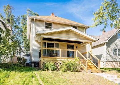 View of front facade with a front lawn, cooling un