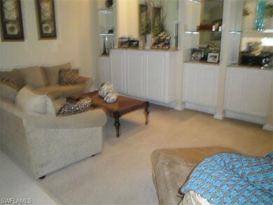Another view of great room with carpeted floor.