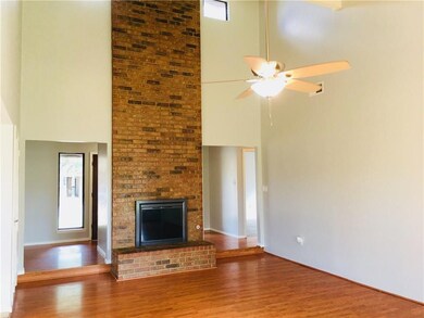 Living room has a gas fireplace, 17 foot ceiling, 