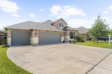 View of front of property with a shingled roof, a