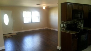 Great room from another view, fireplace is to the