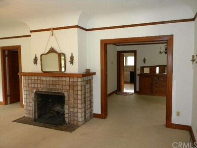 Living room looking into dining room with built-in