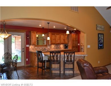 Kitchen. TAKE A LOOK AT THE FLOORS.  THAT S NOT TILE.....STAMPED AND COLORED CONCRETE.