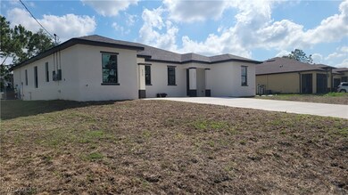 View of front of home featuring stucco siding, a f