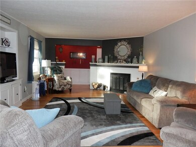 SPACIOUS LIVING ROOM WITH HARDWOOD FLOORS