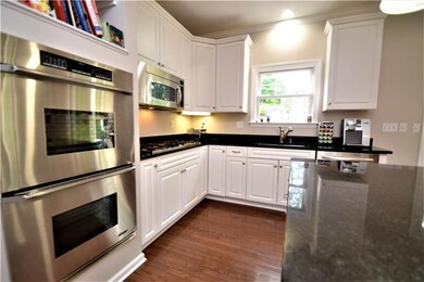 Kitchen with double ovens and cooktop.