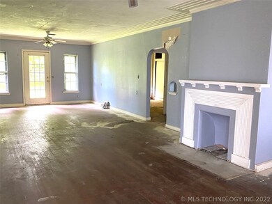 From front door towards back. Living/Dining room combo. Two beds and one bath to the right.