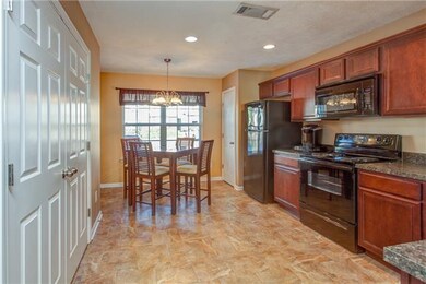 The kitchen is wide with a perfectly sized dining 