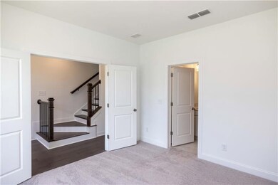 Terrace level bedroom perfect for an office or in home gym.
