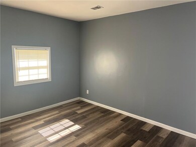 Unfurnished room with visible vents, baseboards, a