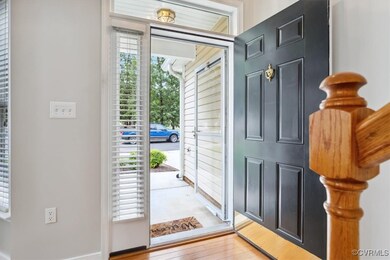 Foyer with light hardwood / wood-style flooring
