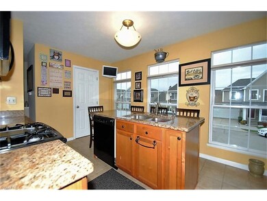Center island with kitchen sink provides a nice us