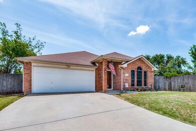 Single story home featuring a front lawn and a gar
