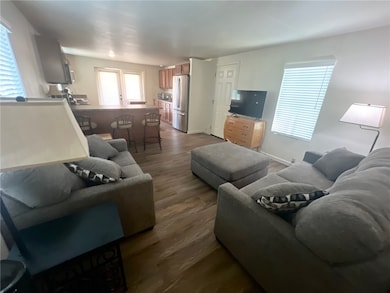 Living area with plenty of natural light and furnished for maximum convenience