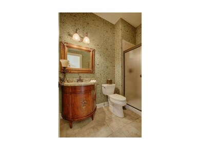 Custom Ethan Allen vanity graces the main floor ba