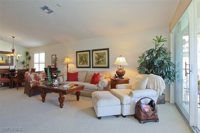 Living room with carpet, and lofted ceiling