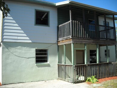 Side exterior view with porches