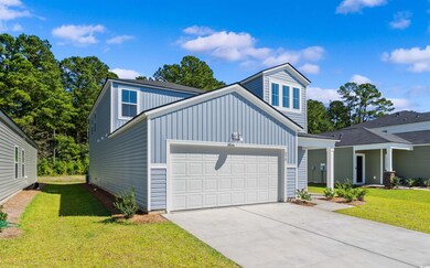 View of front of home featuring concrete driveway,