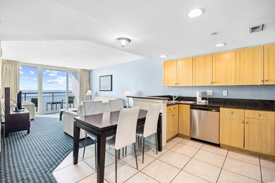 Kitchen with a peninsula, light brown cabinetry, v