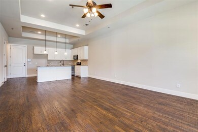 A view of the spacious living room overlooking the kitchen