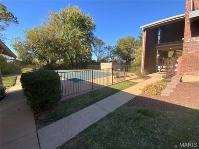 Community pool featuring a balcony