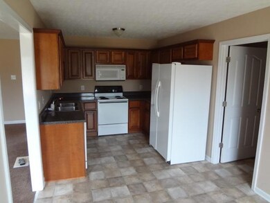 Picture shows all of the appliances that are included with the home with breakfast area is behind the camera.