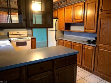 Kitchen with oak cabinets