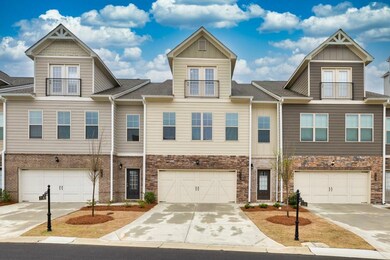 Multi unit property featuring a garage, a balcony,